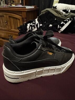 Puma Black Sneakers with White Platform Soles and Gold Logo